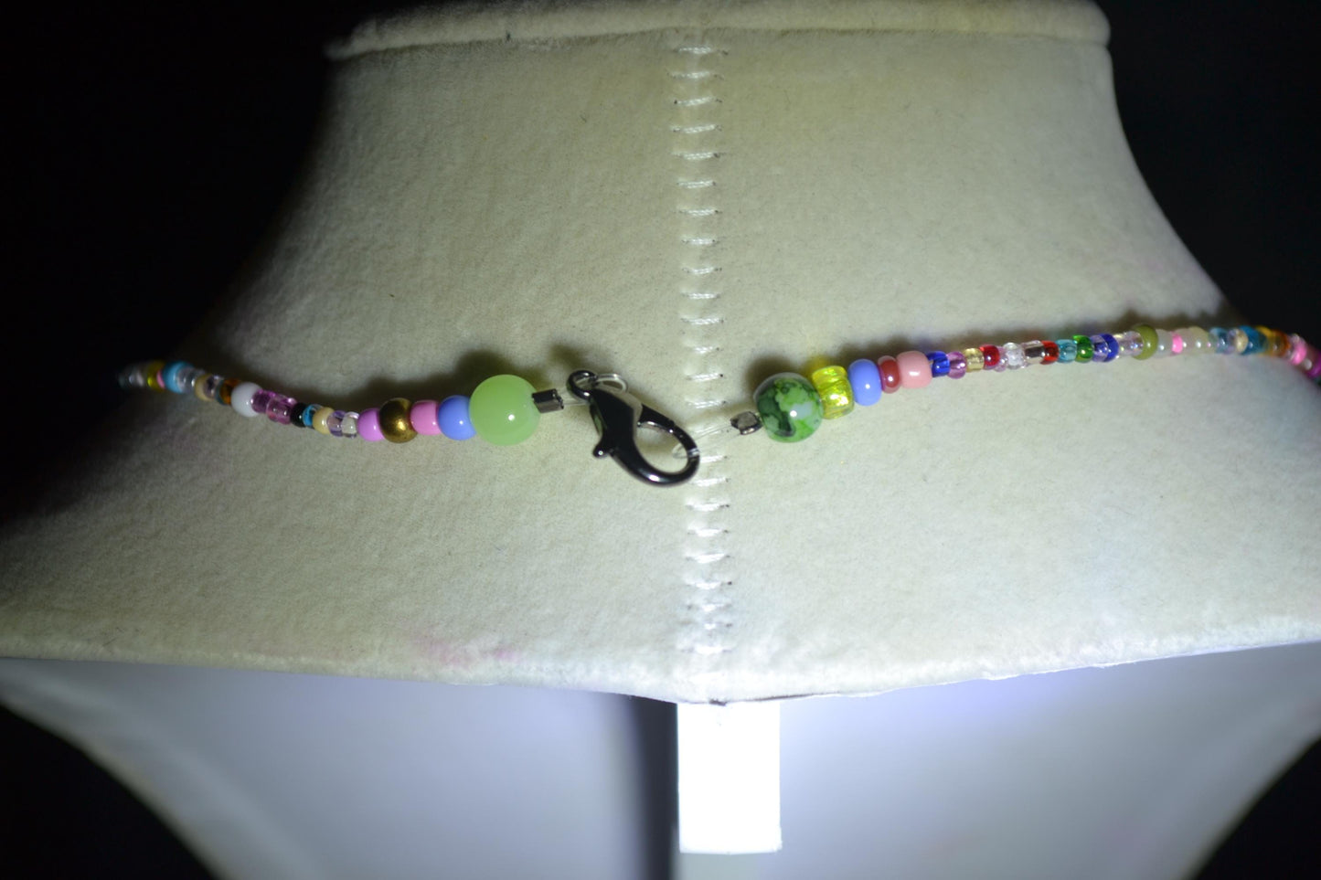 Cross pendant glass bead necklace. Rainbow