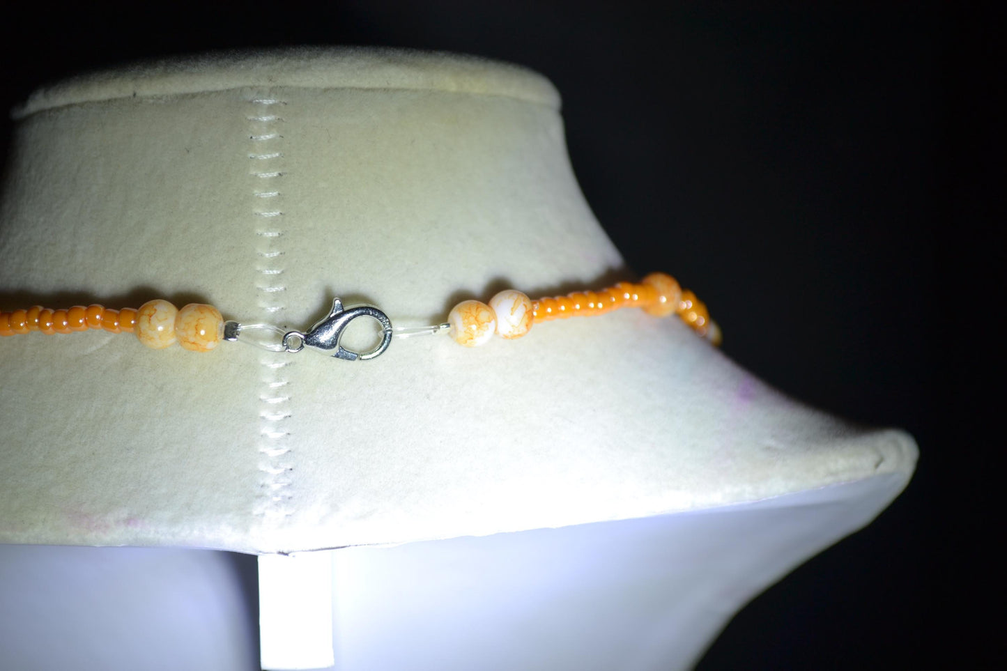 Smiling star pendant glass bead necklace. Mixed oranges