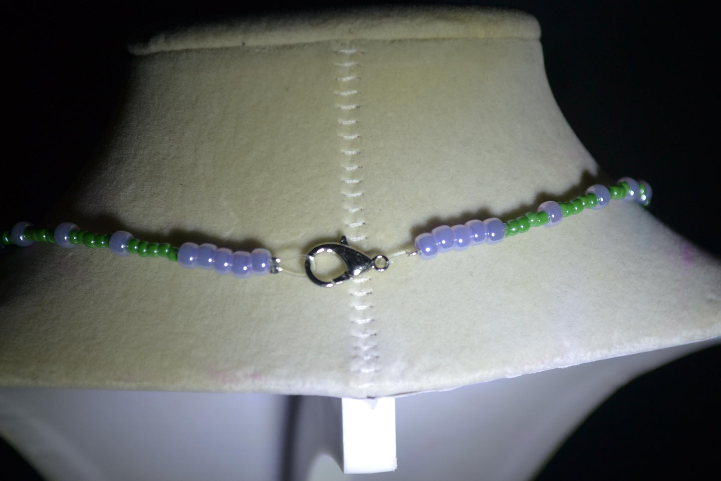 Wire wrapped sharks tooth beaded necklace. Purple and green