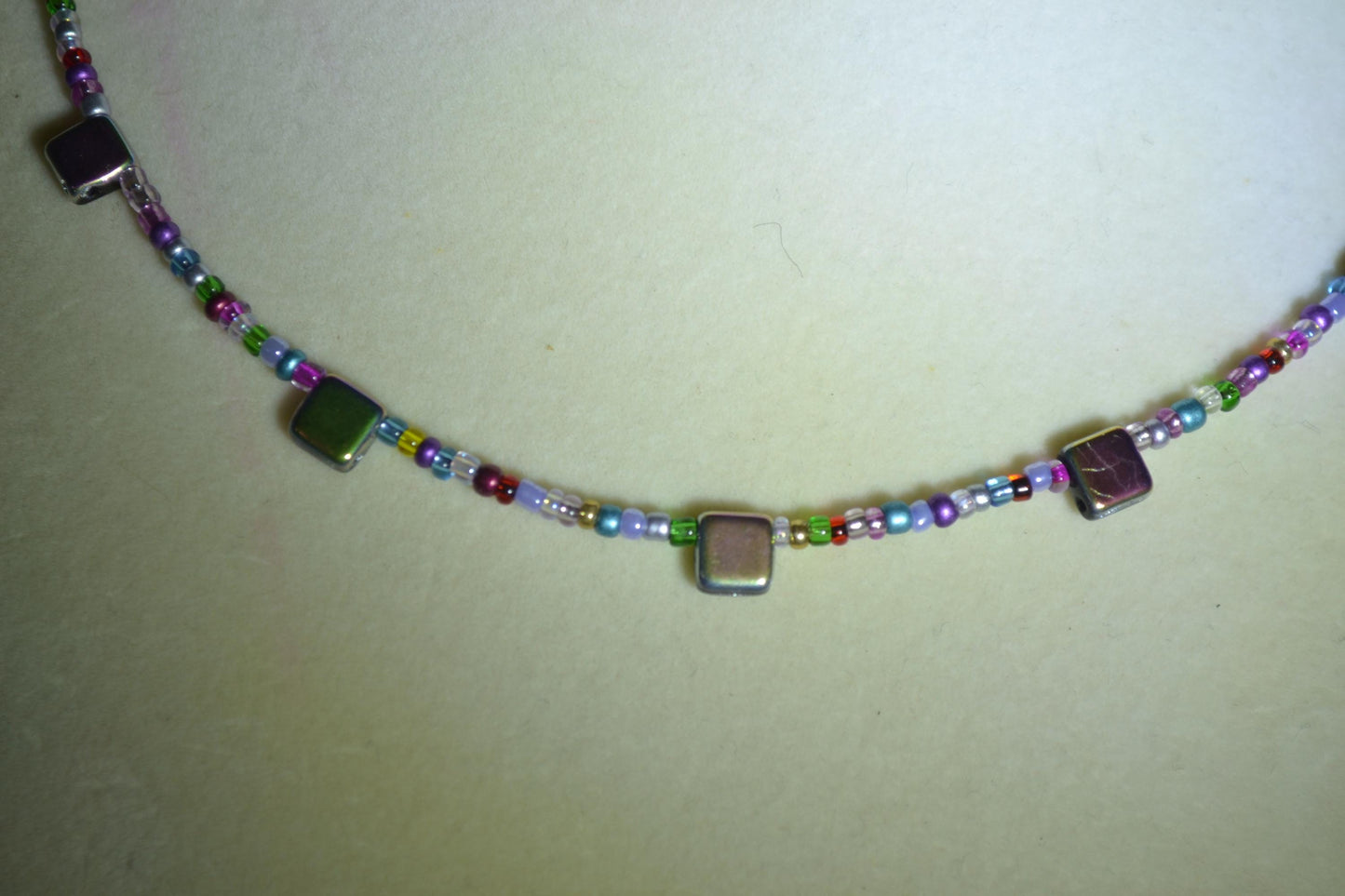 Multicolor glass bead necklace. Reversible rainbow and iridescent black