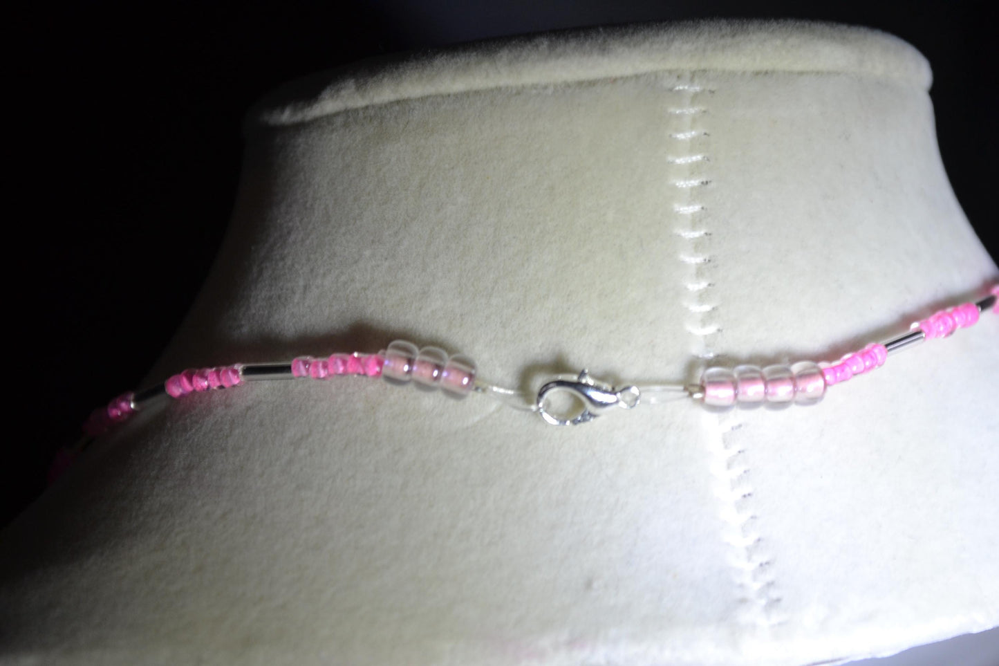 Feather pendant glass bead necklace. Pink and silver