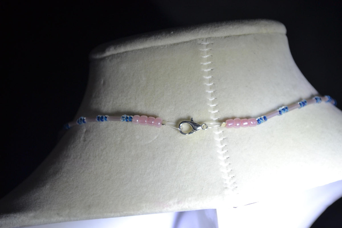 Silver Manatee pendant glass bead necklace. Navy and rose