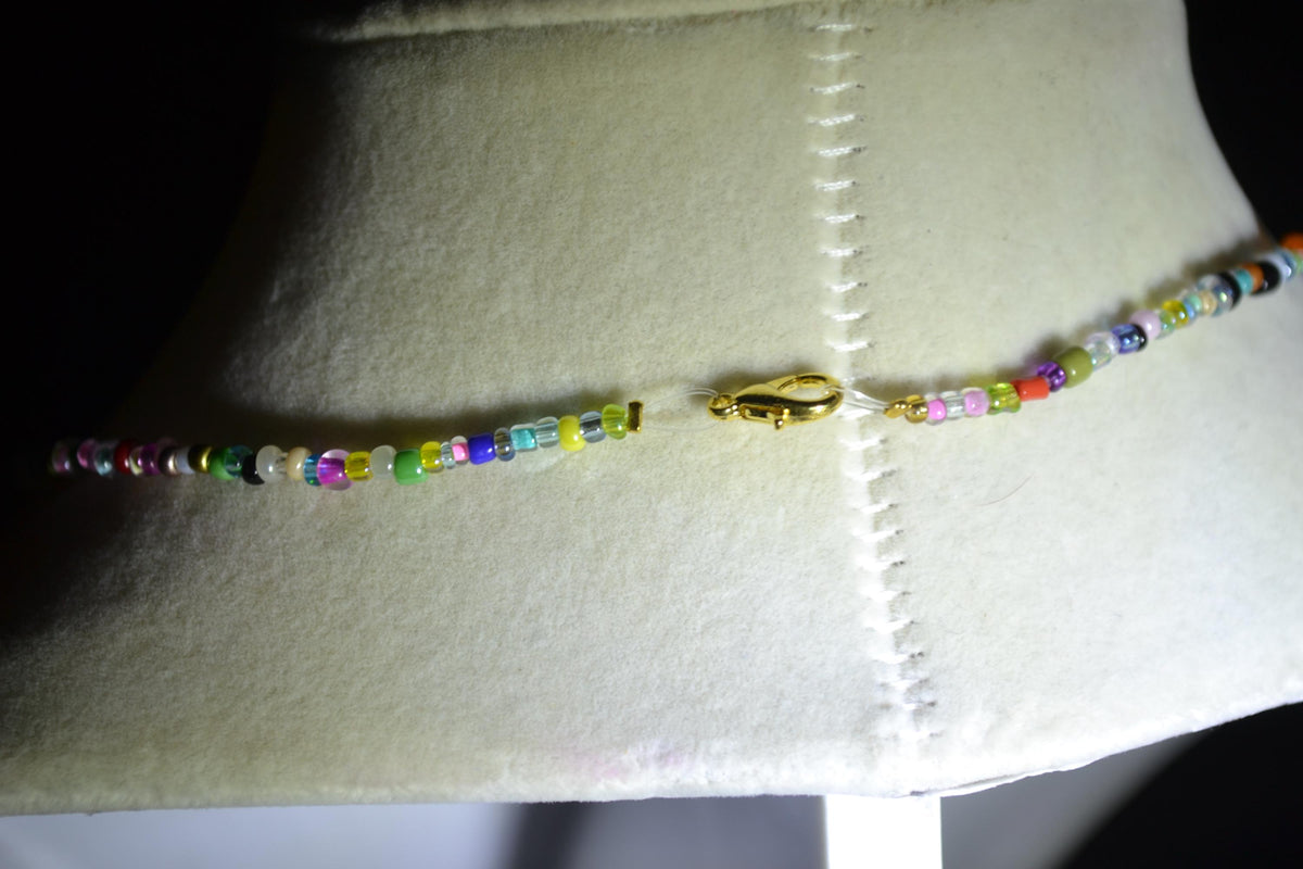 Gold Pegasus pendant glass bead choker. Rainbow