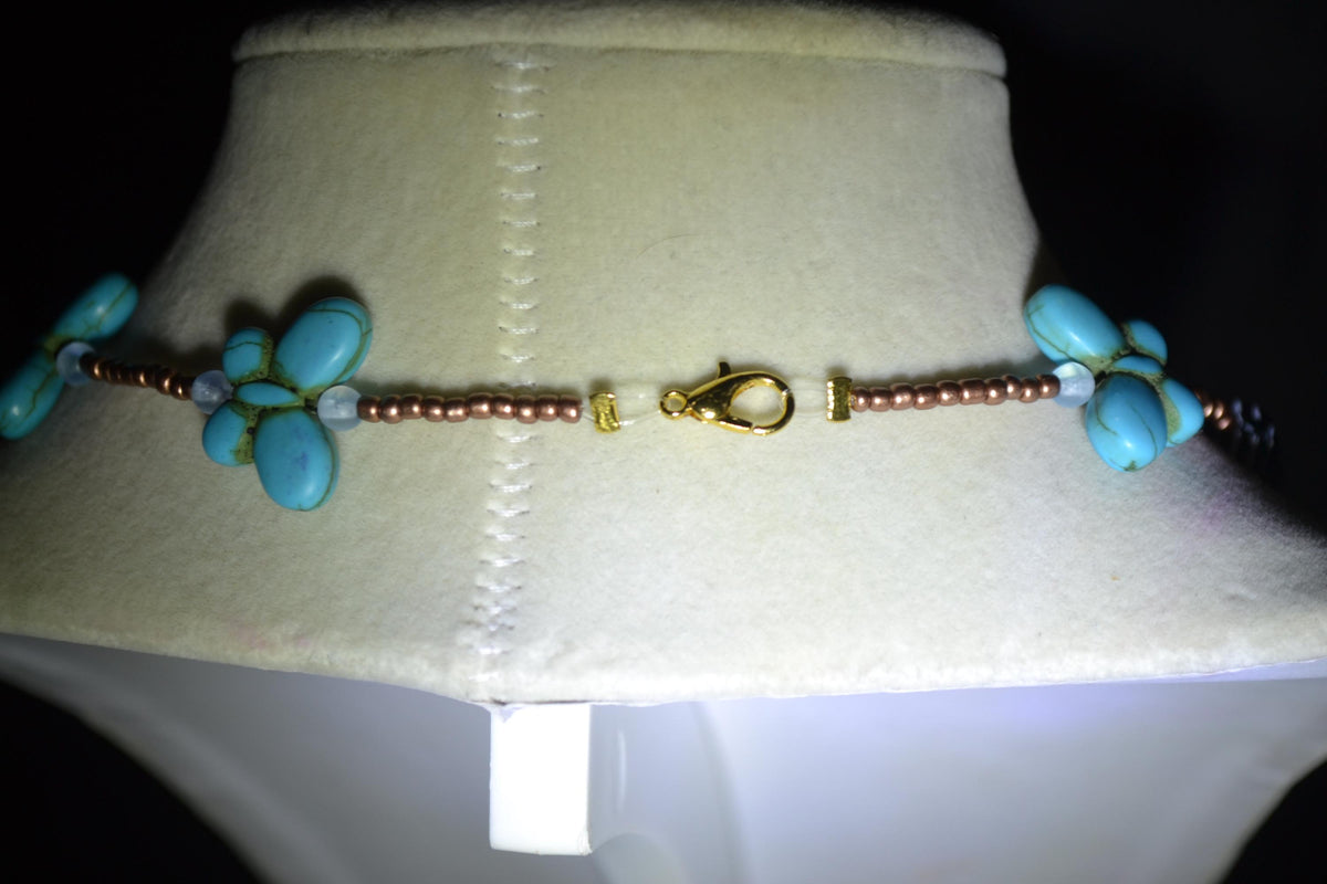 Beaded Butterfly glass necklace. Turquoise, copper, and striped