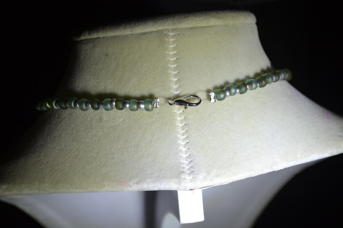 Silver Shark jaws pendant glass bead necklace. Frosted blue & silver