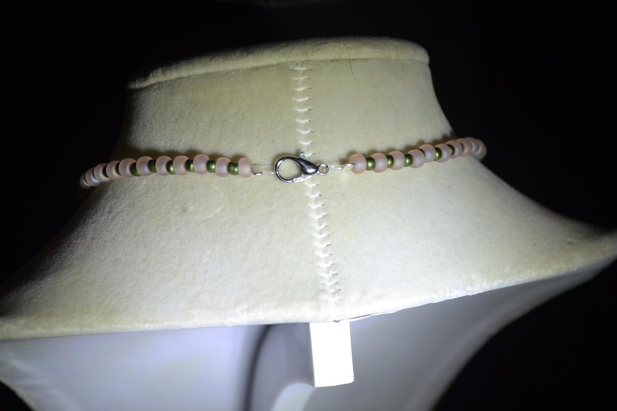 Rhodonite pendant glass bead necklace. Frosted pink & Metallic green