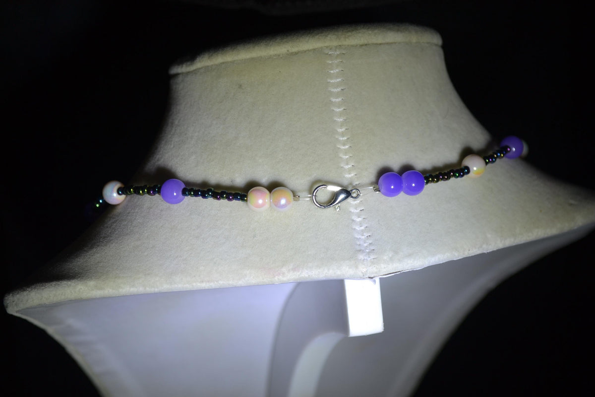 Multicolor glass bead necklace. Pearlescent white, purple. and oil spill
