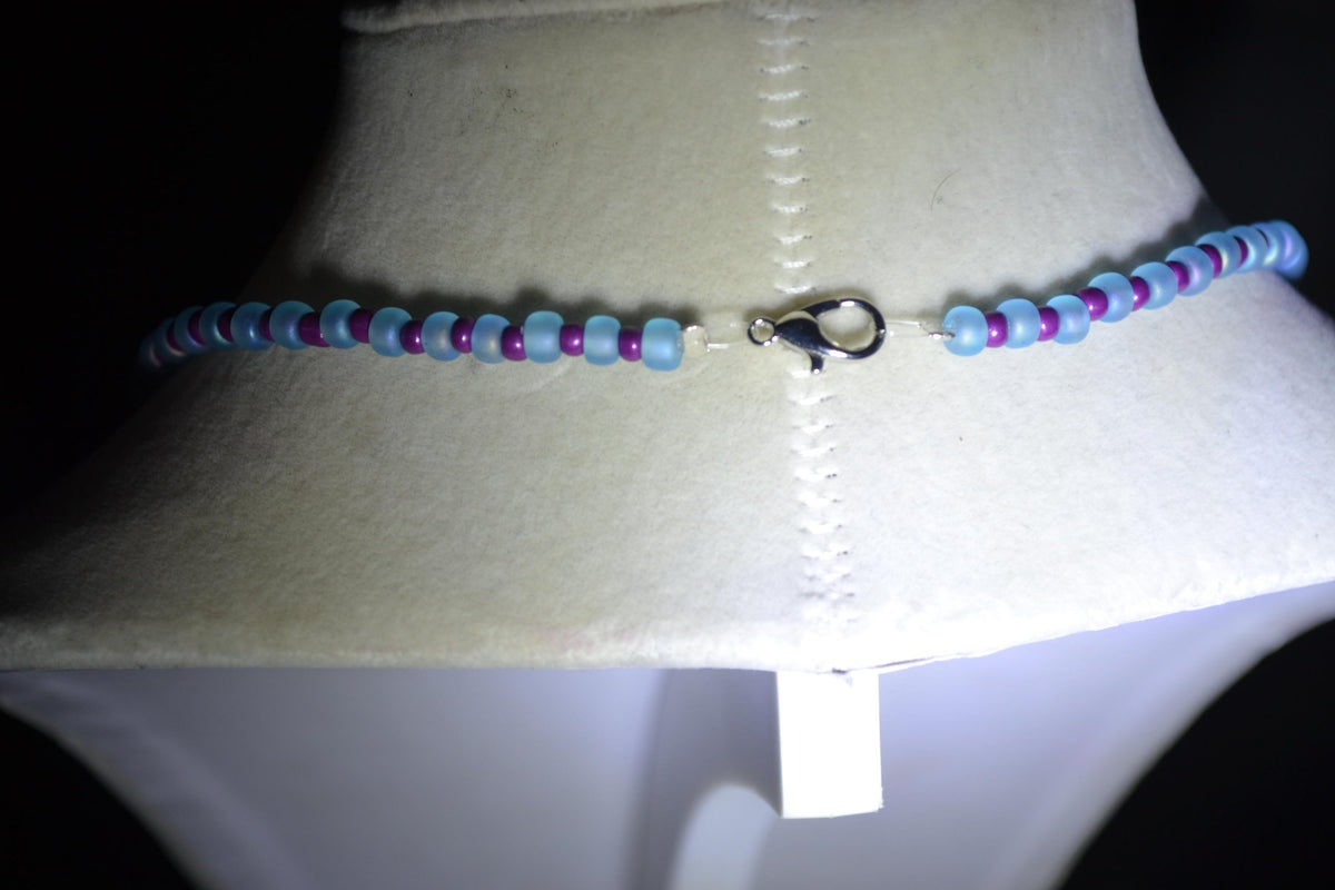 Silver Hammered cactus pendant glass bead necklace. Blue and purple