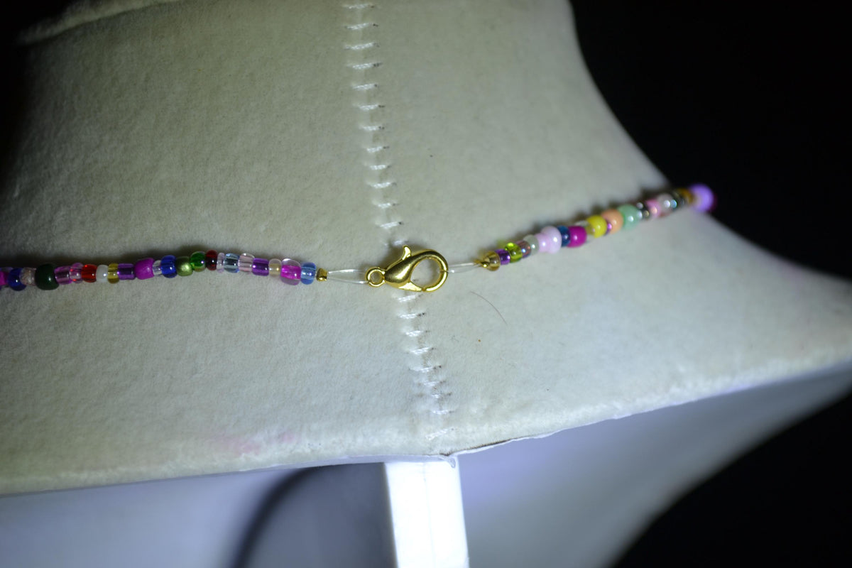 Sunflower pendant glass bead necklace. Rainbow