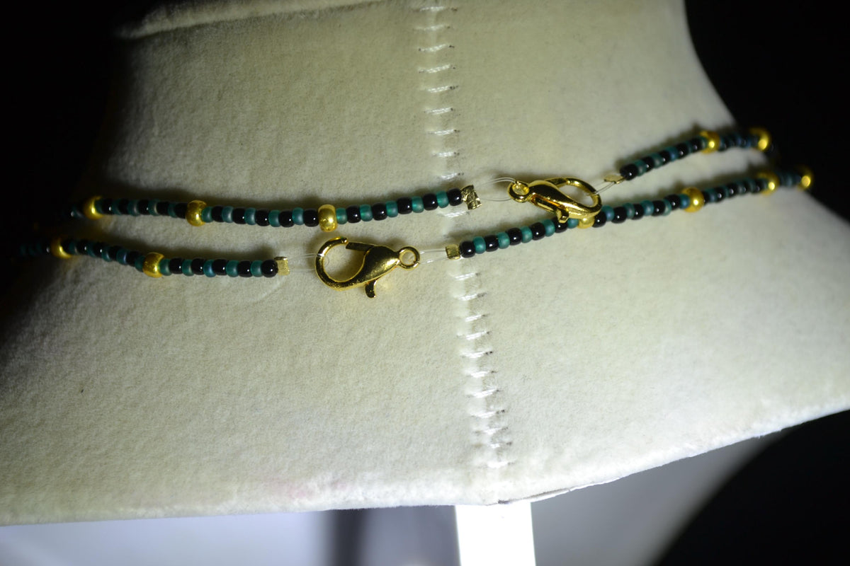 Gold Jaguar pendant glass bead necklaces. Teal, black, and gold