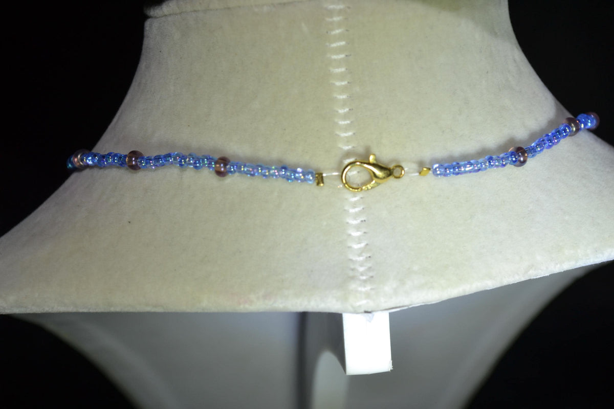 Wire wrapped sharks tooth beaded necklace. Blue and amethyst