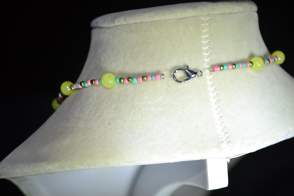 Silver Peace Sign pendant glass bead necklace. Yellow, teal, pink, and green