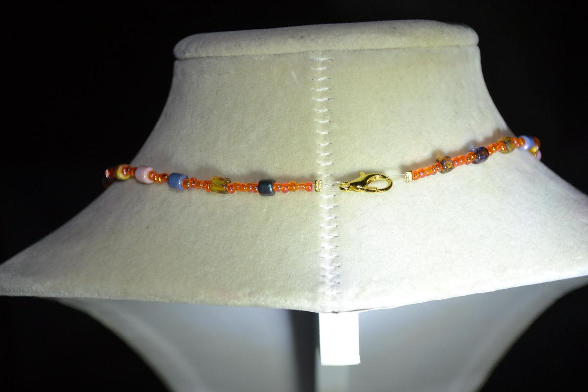 Green Palms pendant glass bead necklace. Orange and Picasso mix