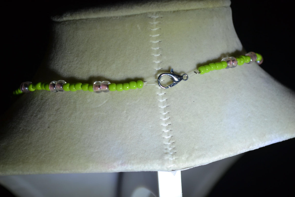 Silver Flamingo pendant glass bead necklace. Green and pink