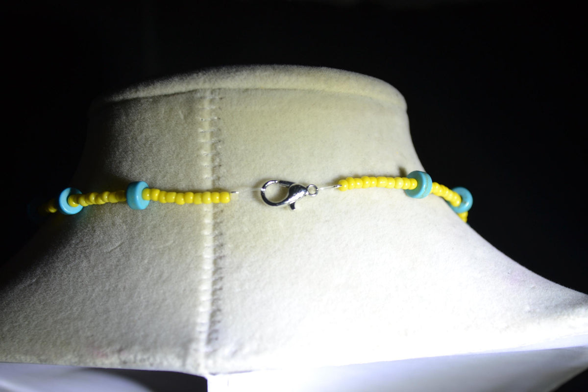Silver bee pendant glass bead necklace. Turquoise and yellow