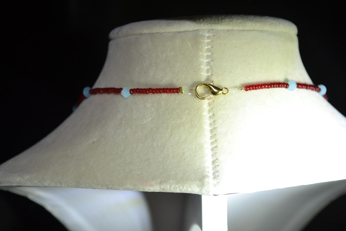 Beaded Cross glass necklace. Red, white, and blue