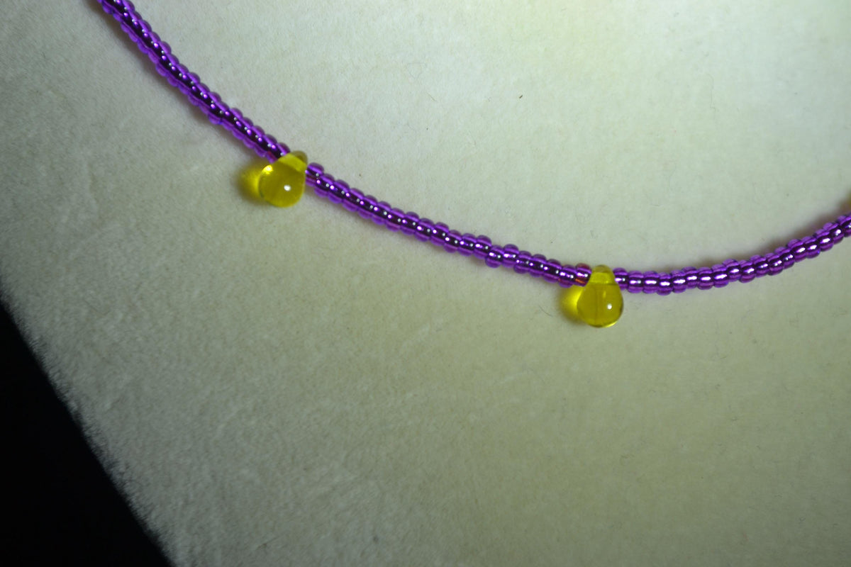 Multicolor glass bead necklace. Purple and yellow drops