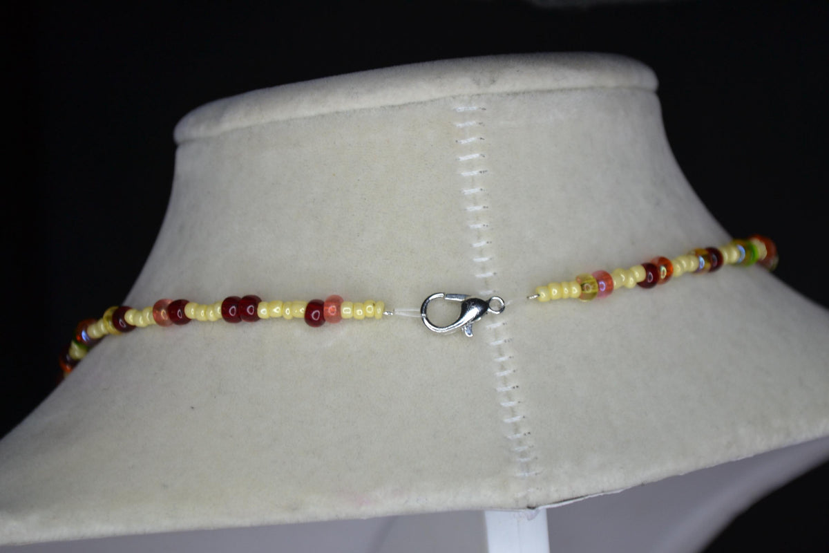 Red and Yellow Dragonfly pendant glass bead necklace. Butter yellow and rainbow