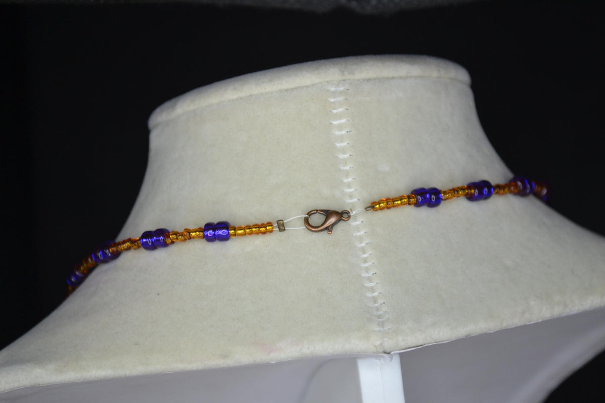 Wire wrapped sharks tooth beaded necklace. Brown and indigo