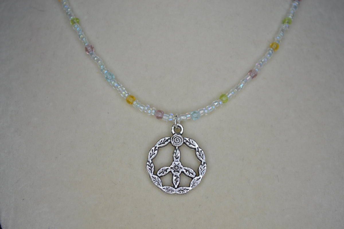 Silver peace sign pendant glass bead choker. Pastel and iridescent crystal