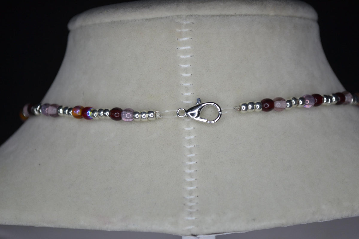 Silver Hamsa pendant glass bead necklace. Reds, silver, lavender, and orange