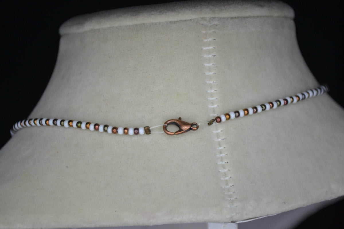 Bronze Sand dollar pendant glass bead necklace. White and bronzes