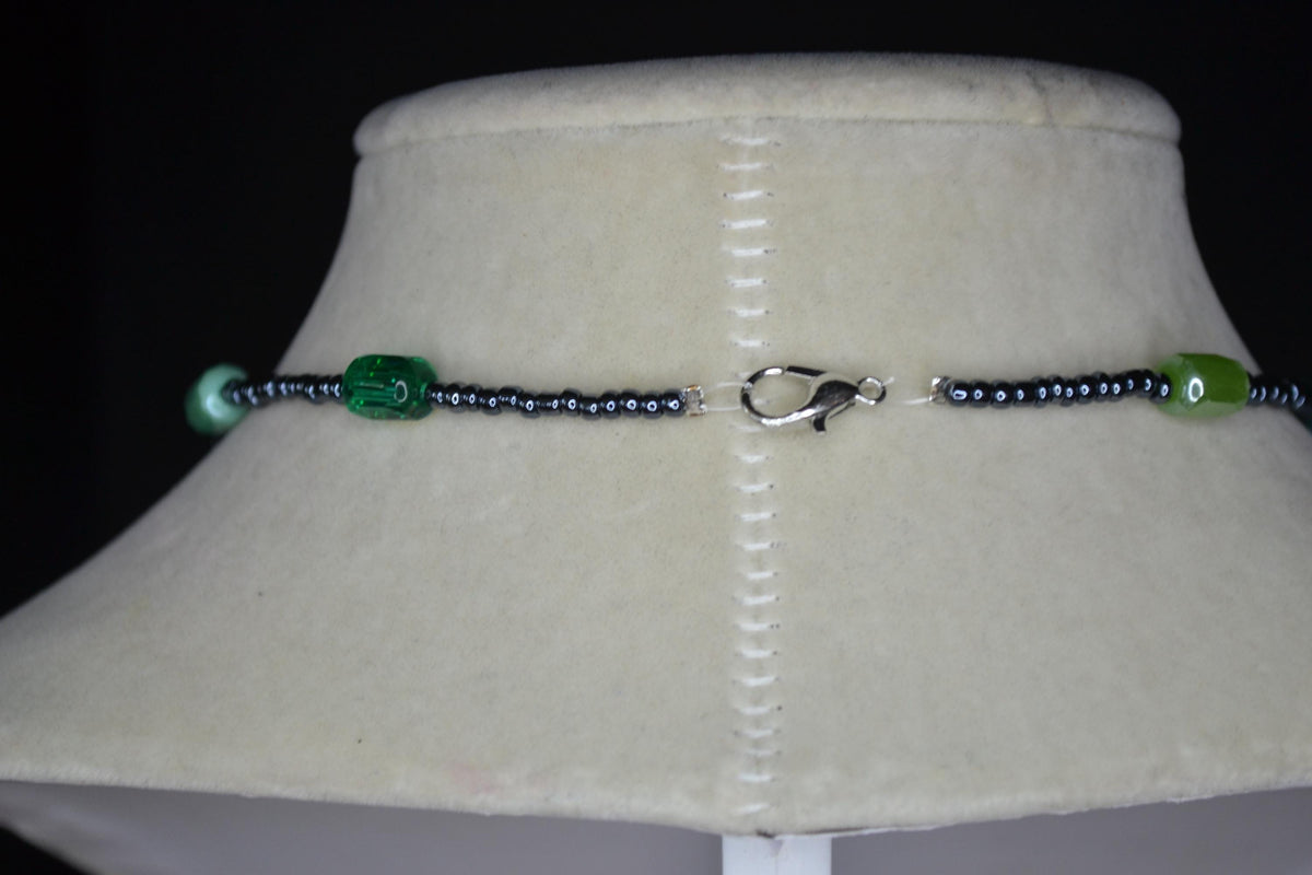 Silver Frog pendant glass bead necklace. Greens and metallic black