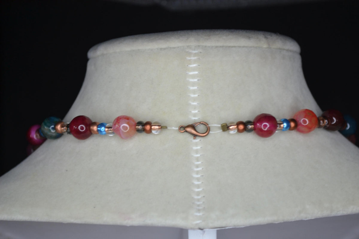 Multicolor glass beaded necklace. Reds, blues, and bronze