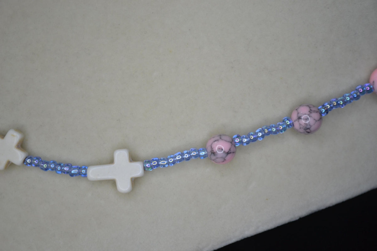 Beaded Cross glass necklace. Pink turquoise, white, and blue