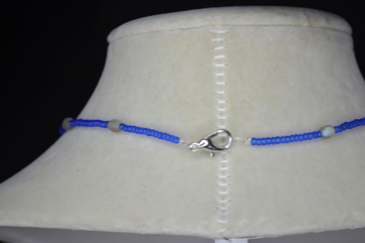 Silver Manatee pendant glass bead necklace. Cobalt and iridescent sea glass