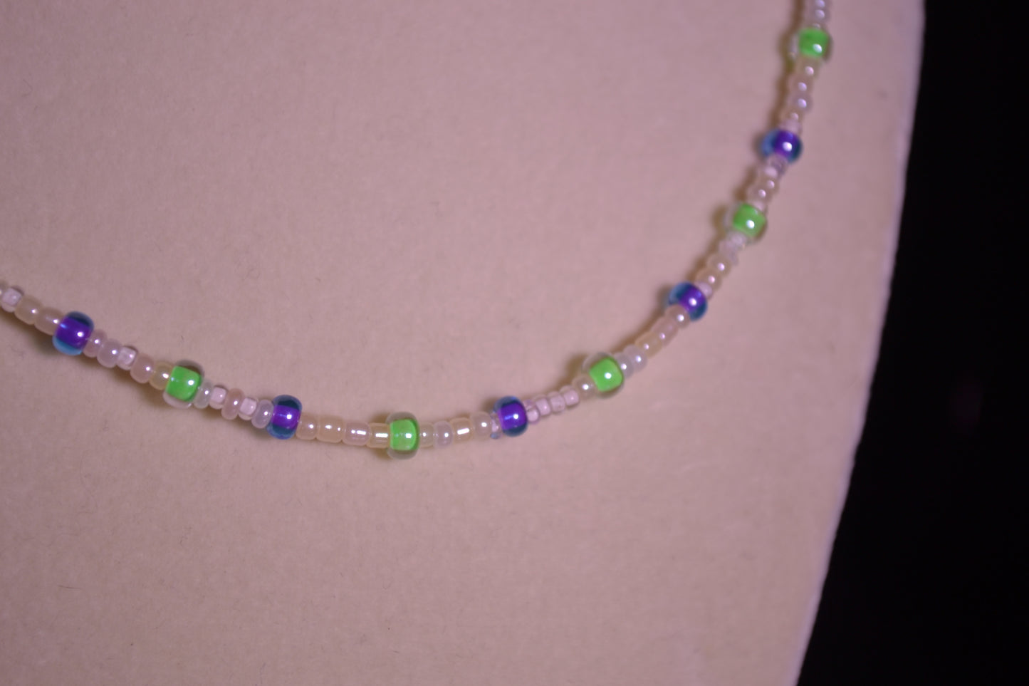 Purple and green glass bead necklace