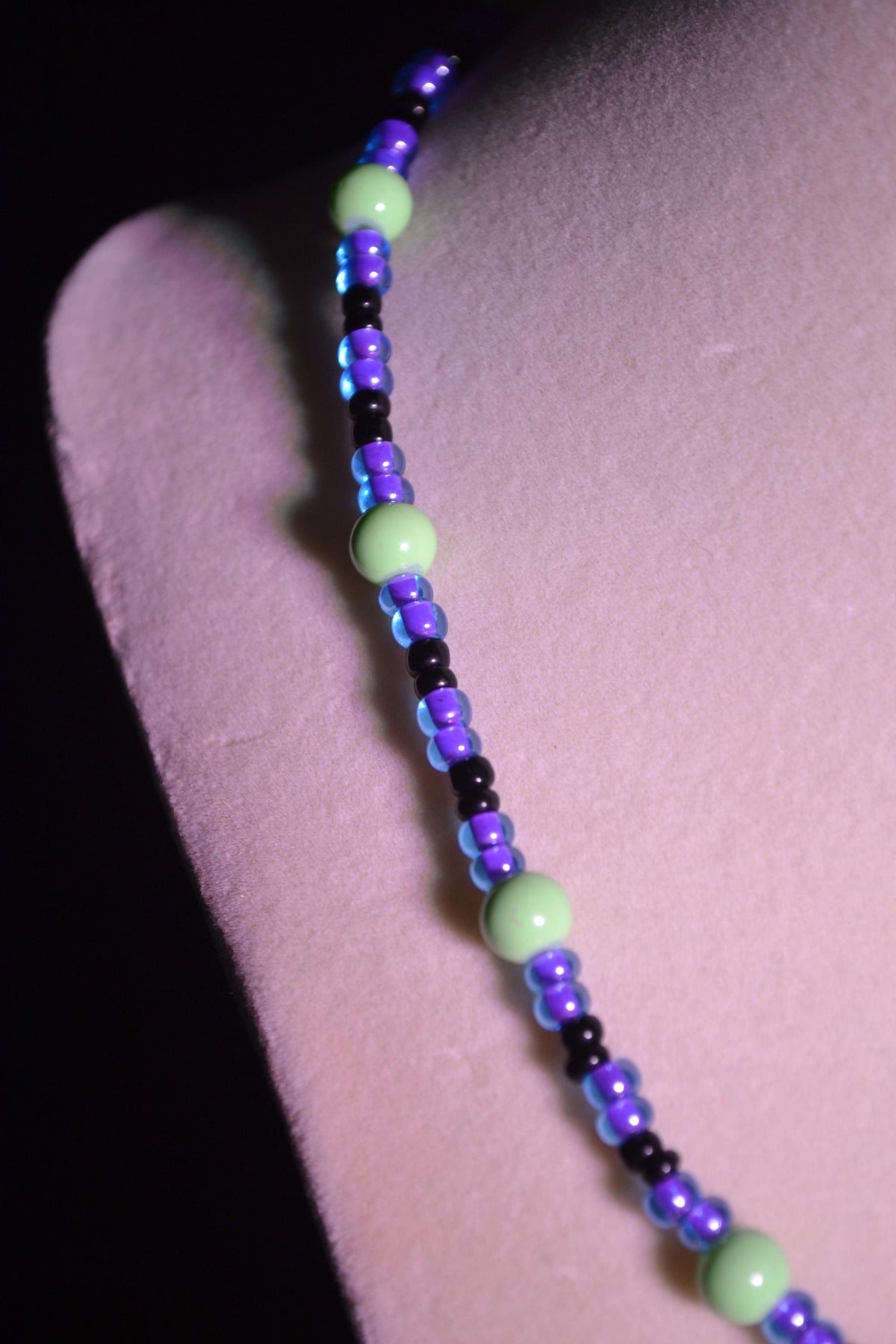 Multicolor glass bead necklace. Purple, green, and black