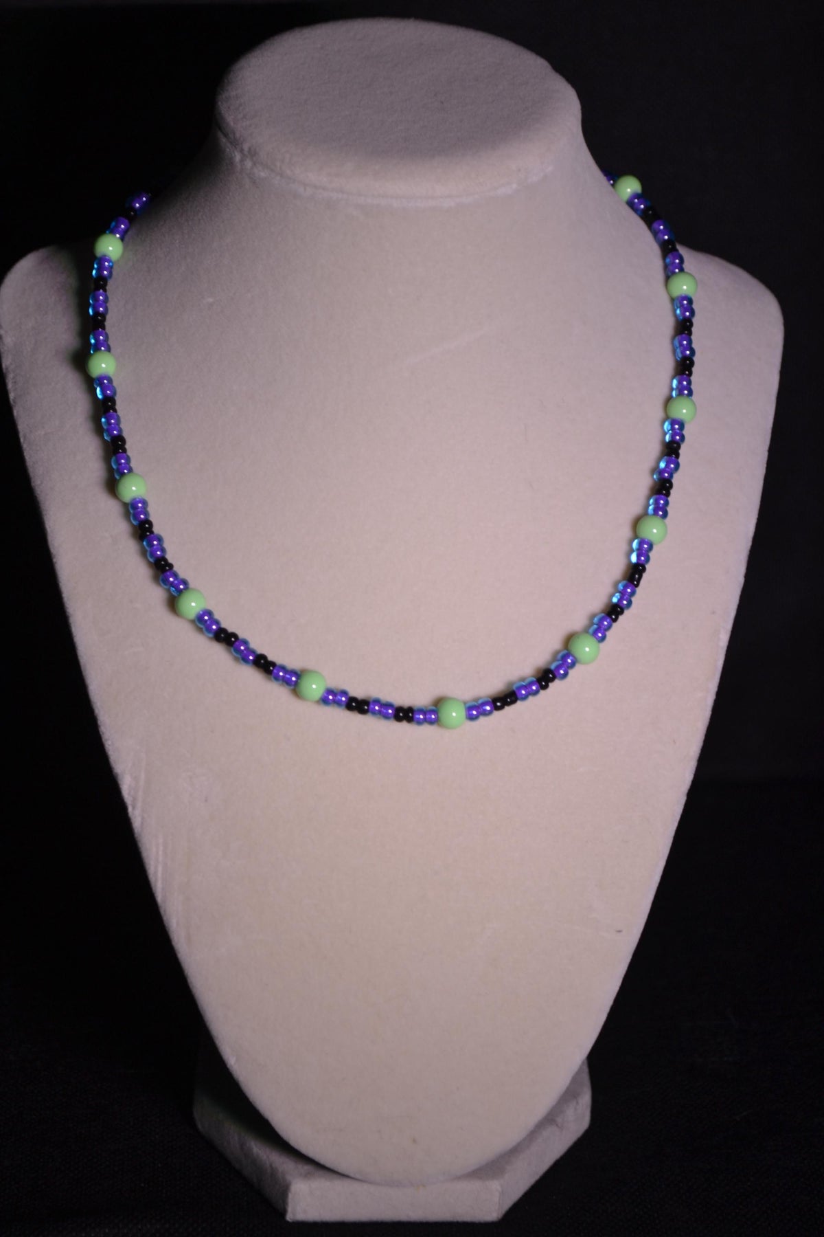 Multicolor glass bead necklace. Purple, green, and black