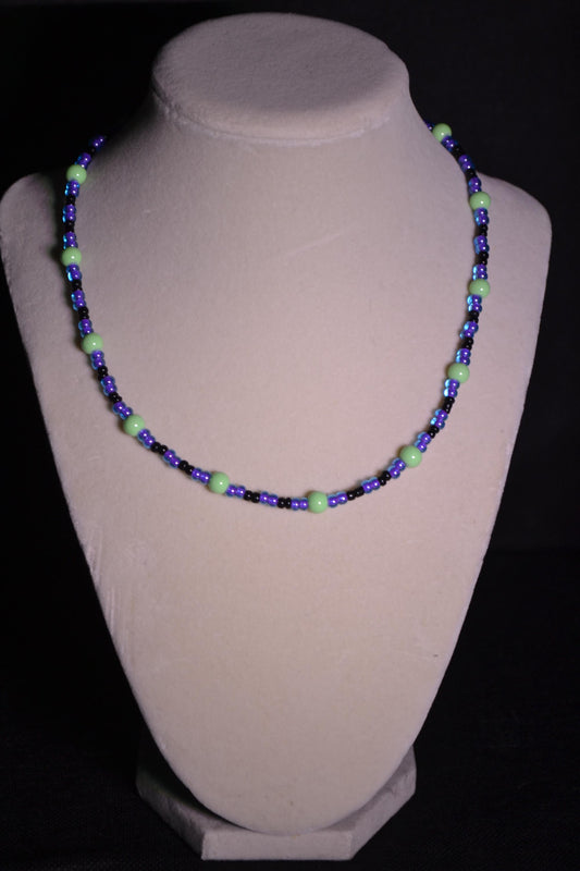 Multicolor glass bead necklace. Purple, green, and black