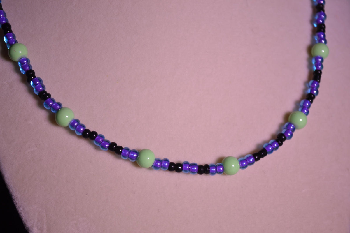 Multicolor glass bead necklace. Purple, green, and black