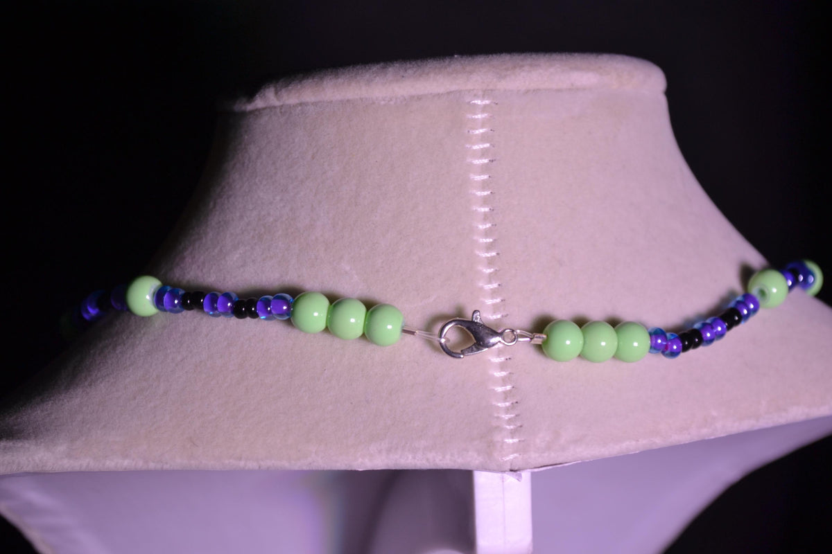 Multicolor glass bead necklace. Purple, green, and black
