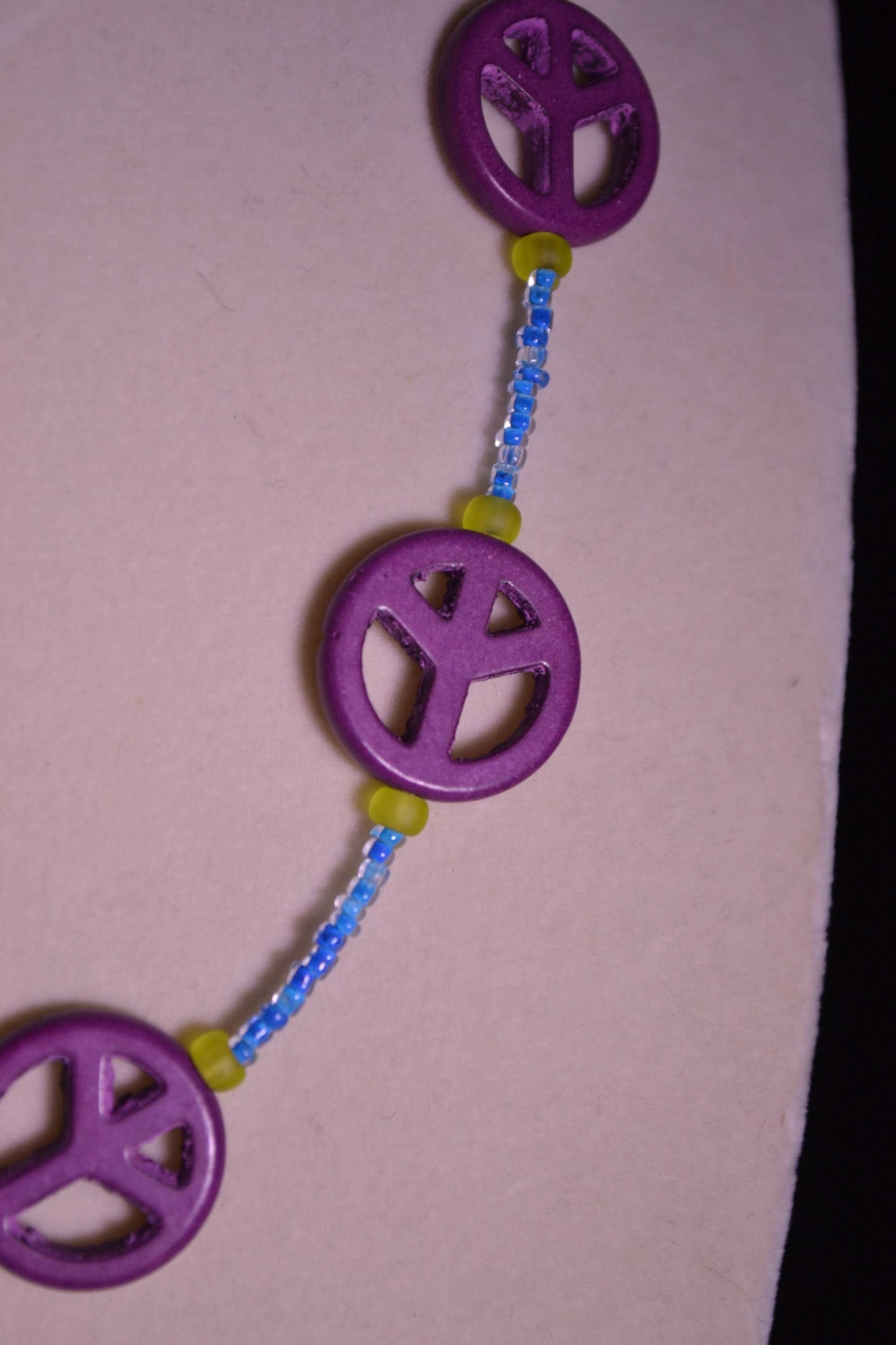 Multicolor glass bead necklace. Peace sign, blue, and green