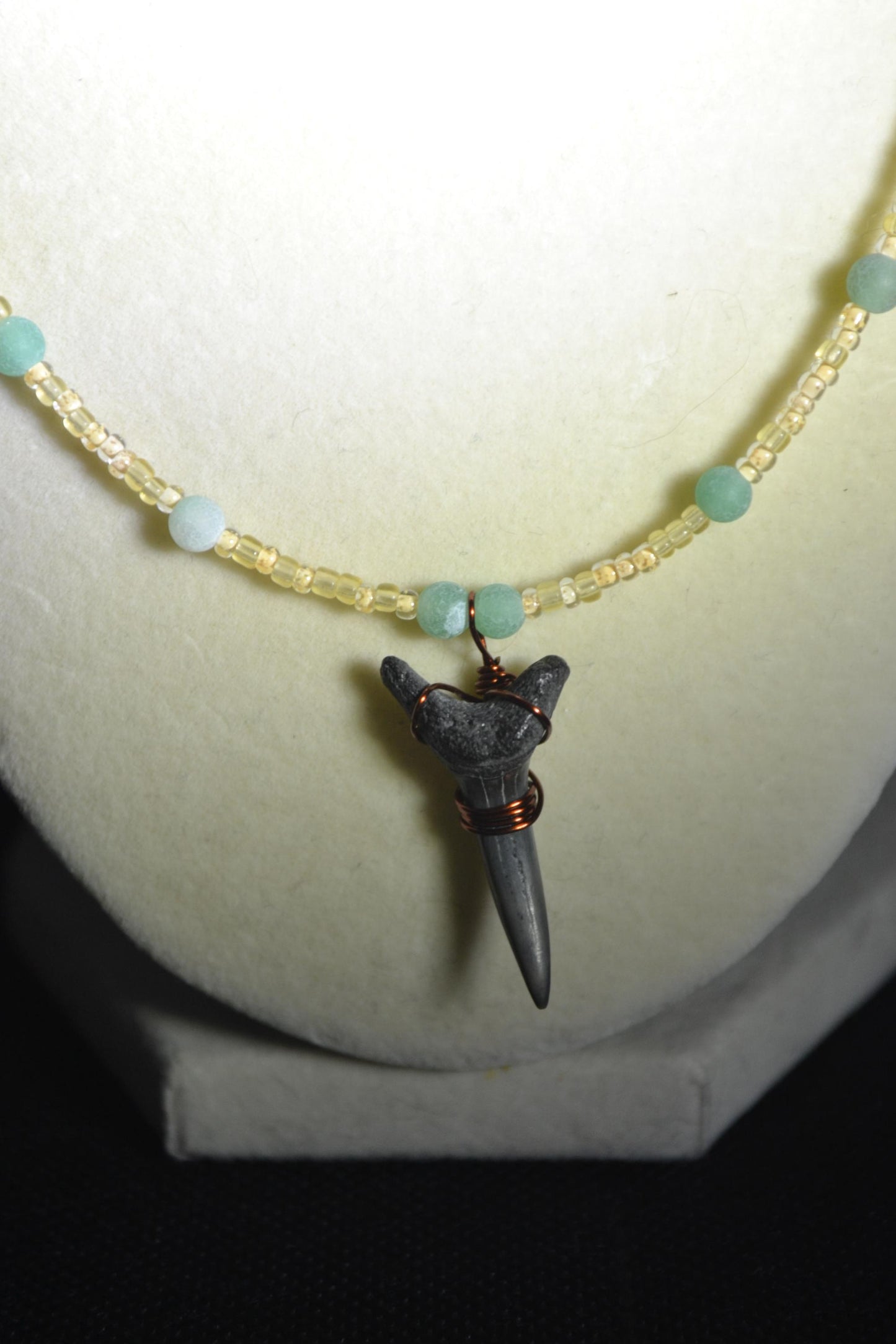 Wire wrapped sharks tooth beaded necklace. Yellow and green