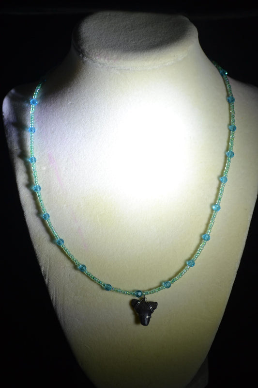 Wire wrapped sharks tooth beaded necklace. Blues