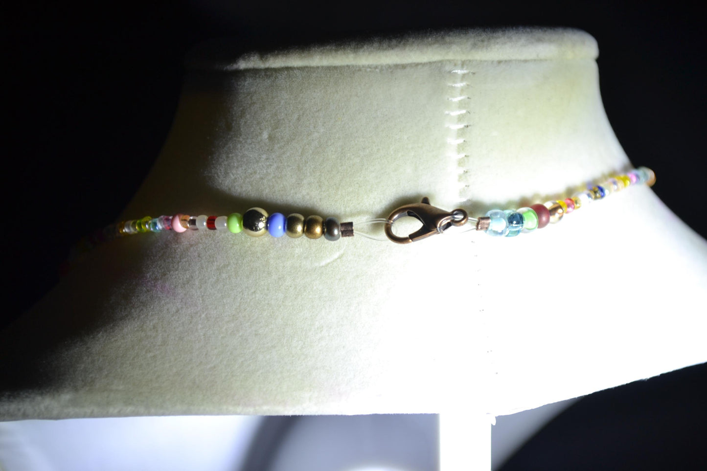 Multicolor glass bead necklace. Feather pendant