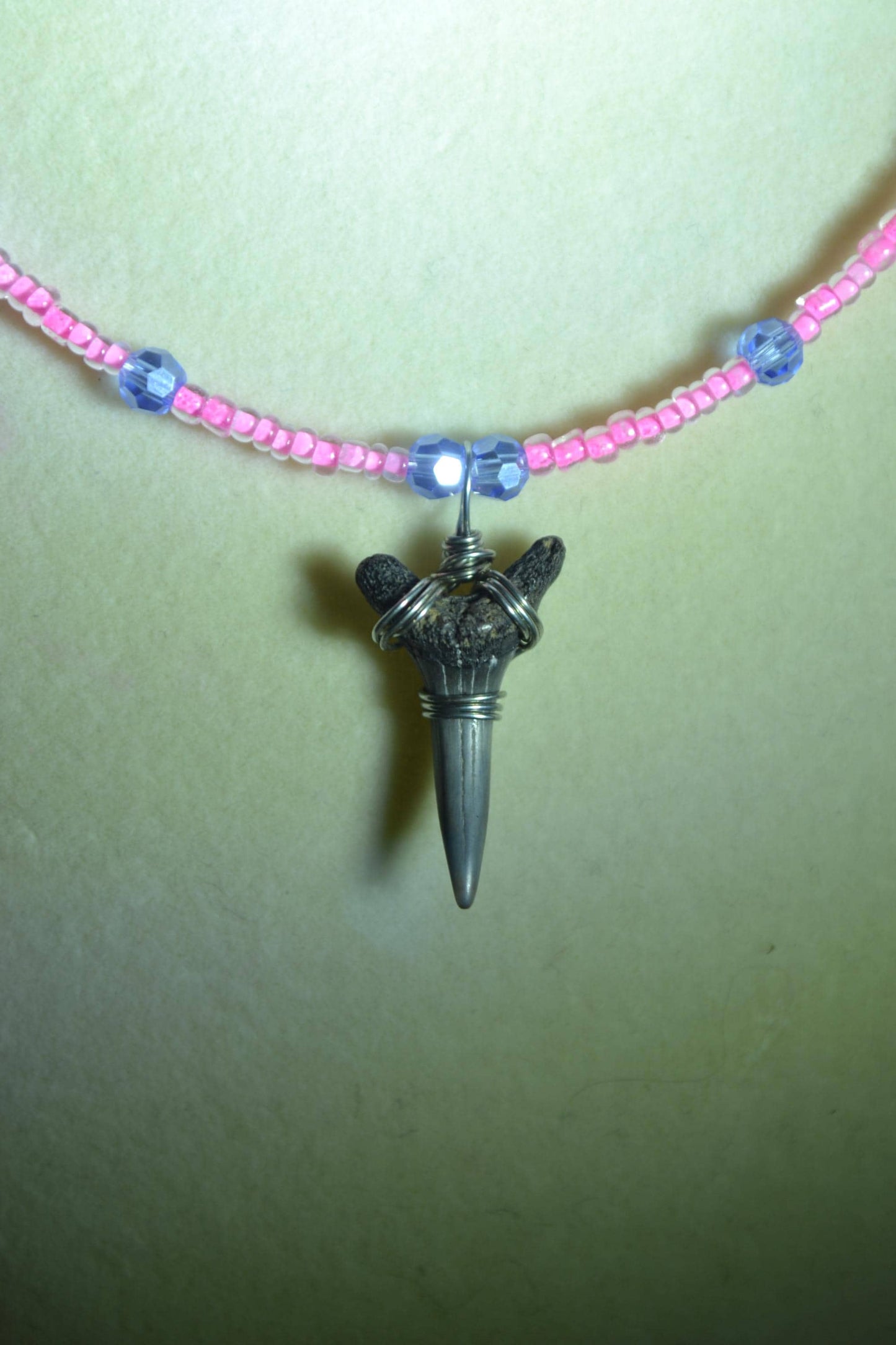 Wire wrapped sharks tooth beaded necklace. Blue and pink