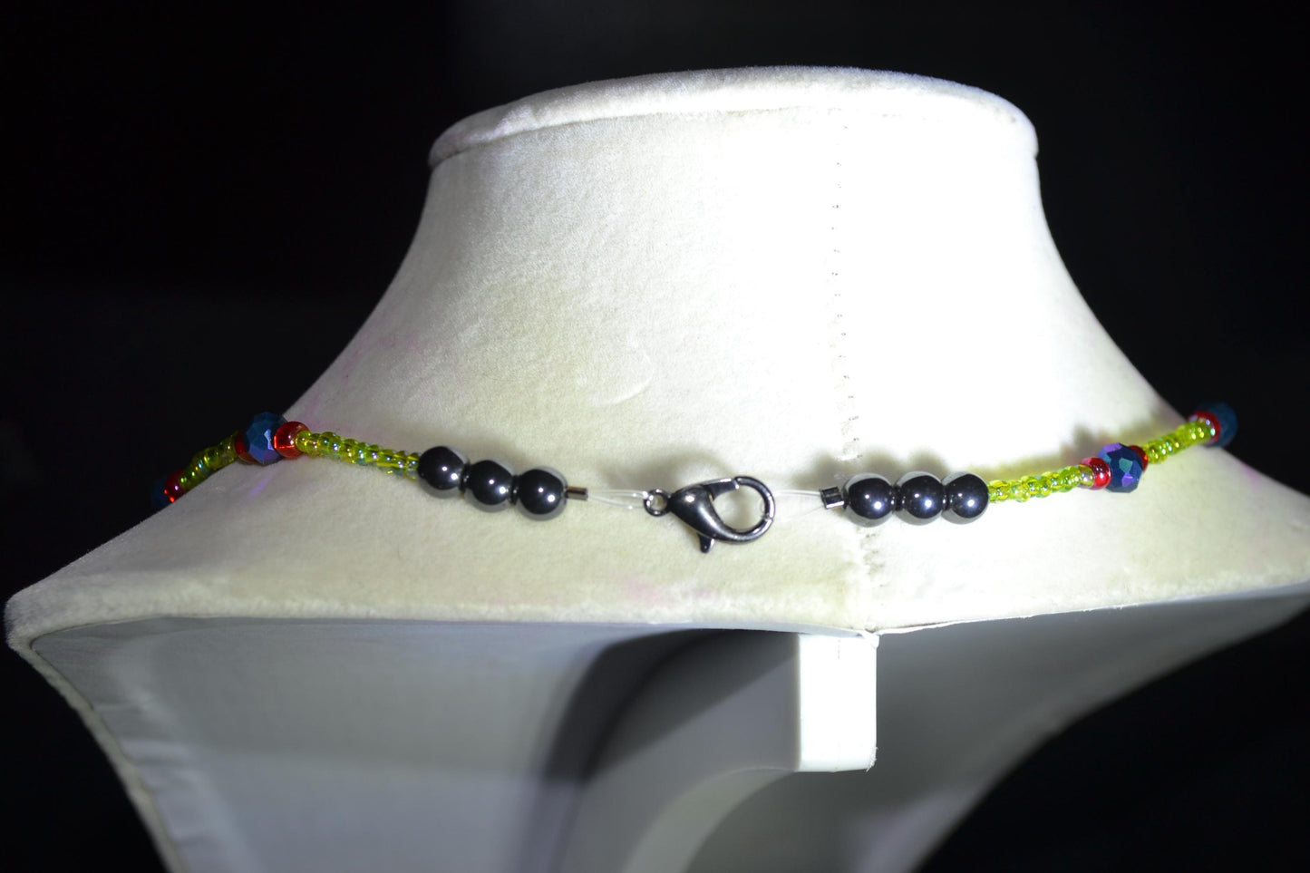 Multicolor glass bead necklace. Green, black, and red