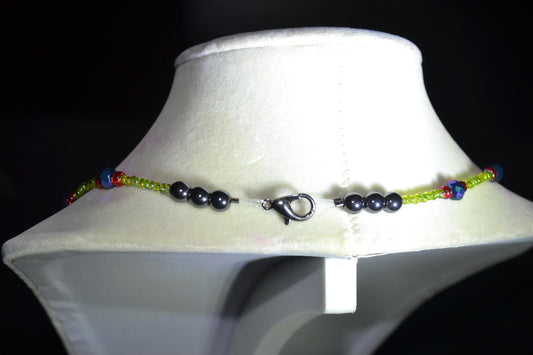 Multicolor glass bead necklace. Green, black, and red