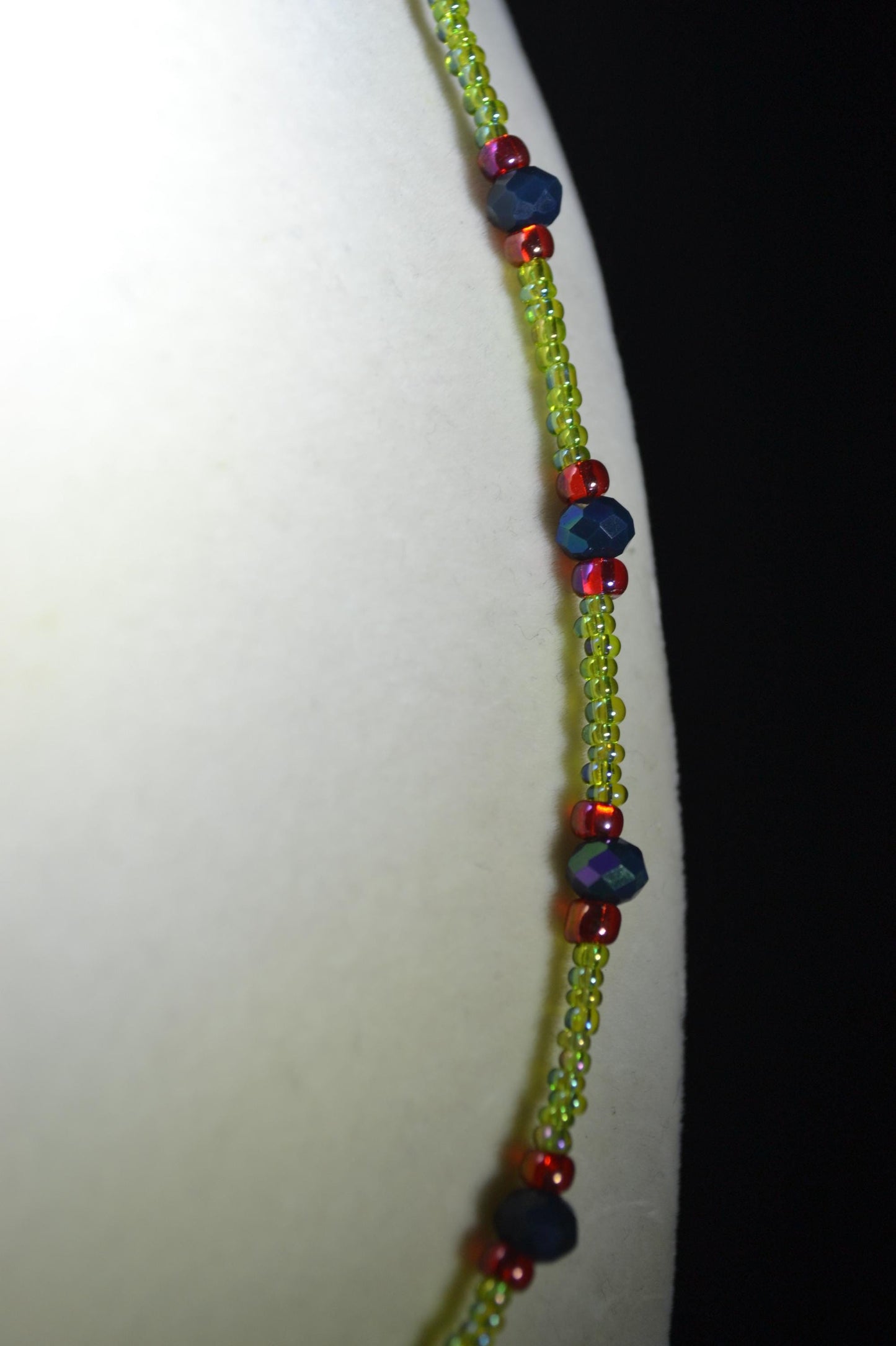 Multicolor glass bead necklace. Green, black, and red