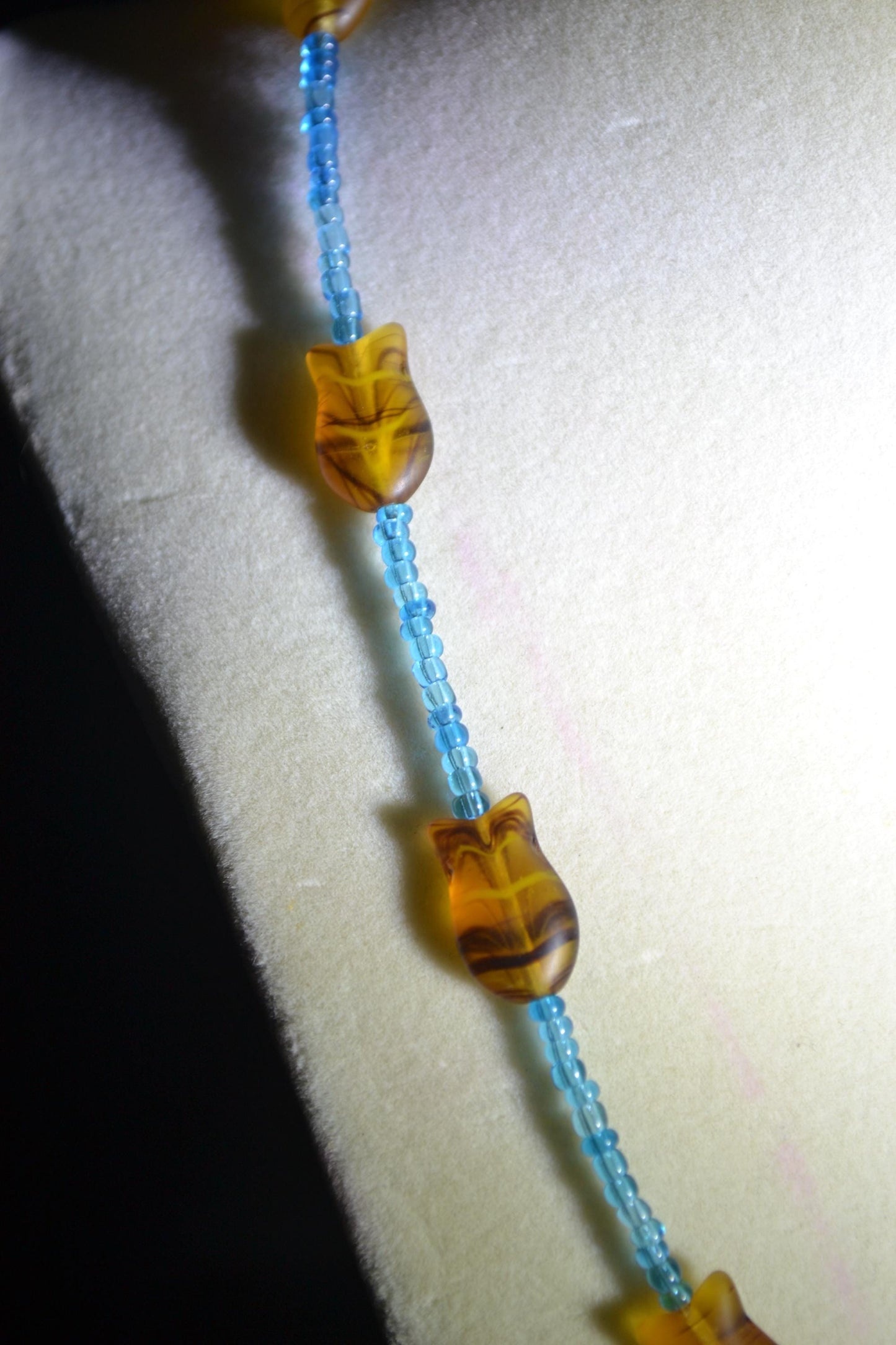 Beaded fish necklace. Blue and topaz