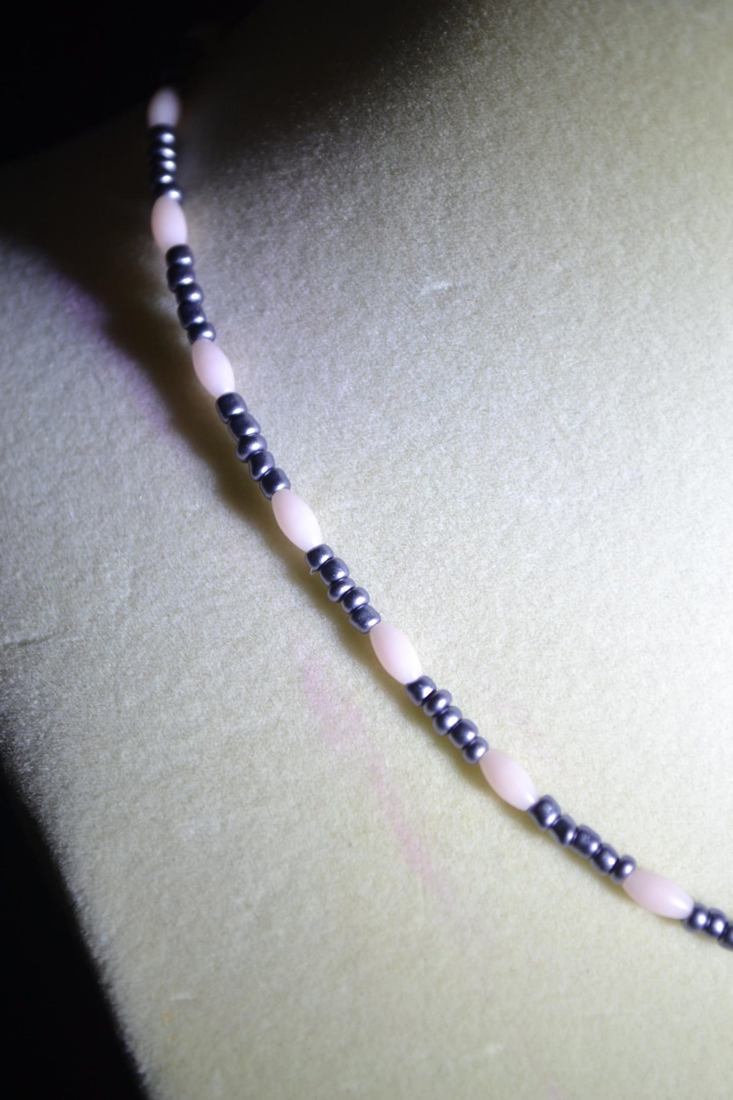 Wire wrapped sharks tooth beaded necklace. Pink and gunmetal