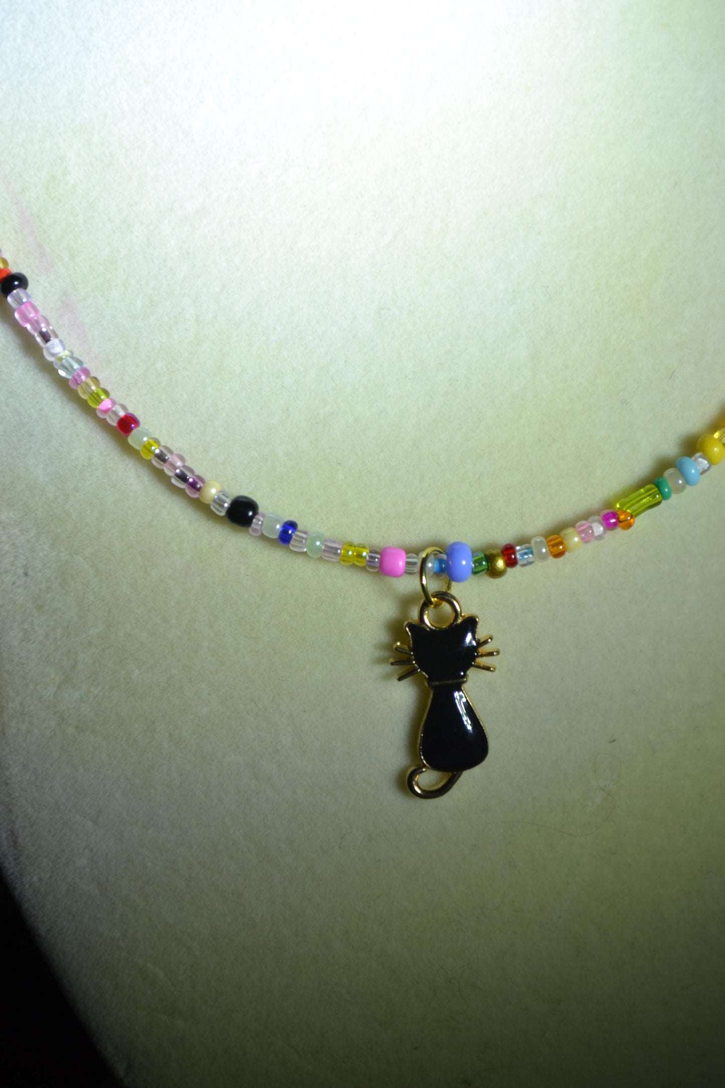 Multicolor glass bead necklace. Black cat pendant