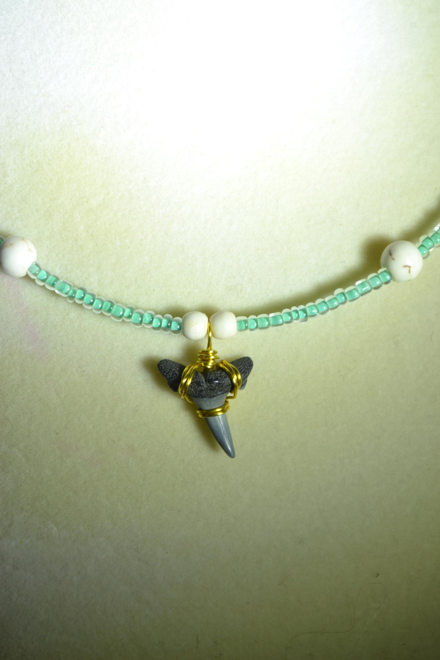 Wire wrapped sharks tooth beaded necklace. Teal and white
