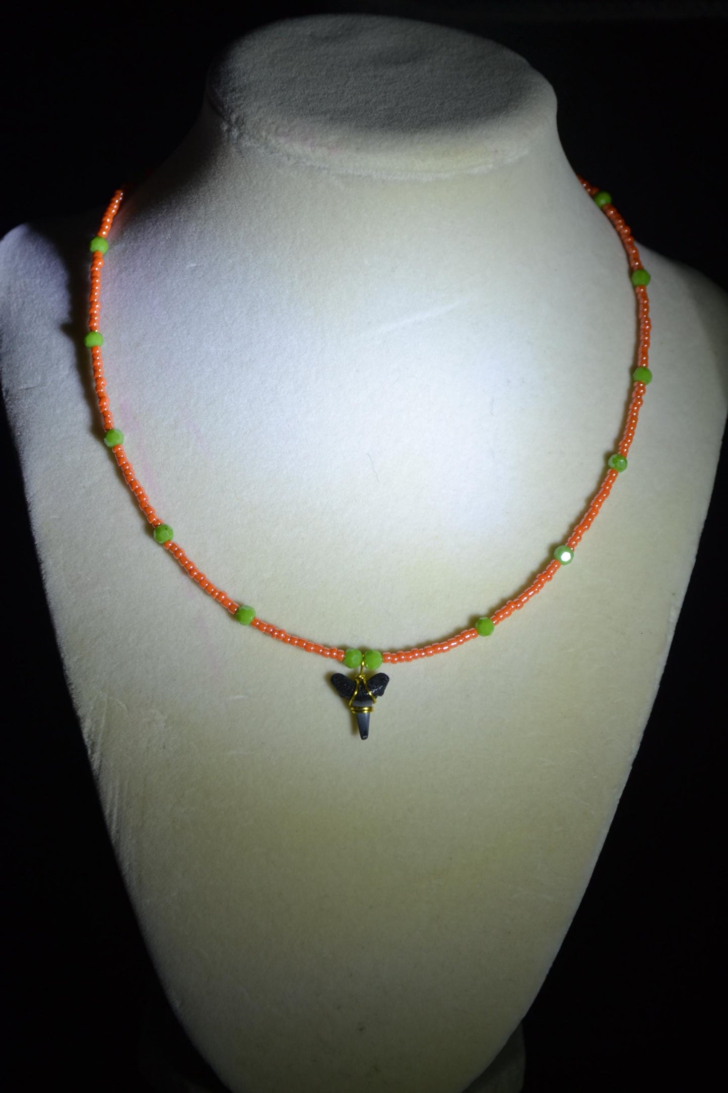 Wire wrapped sharks tooth beaded necklace. Coral and green