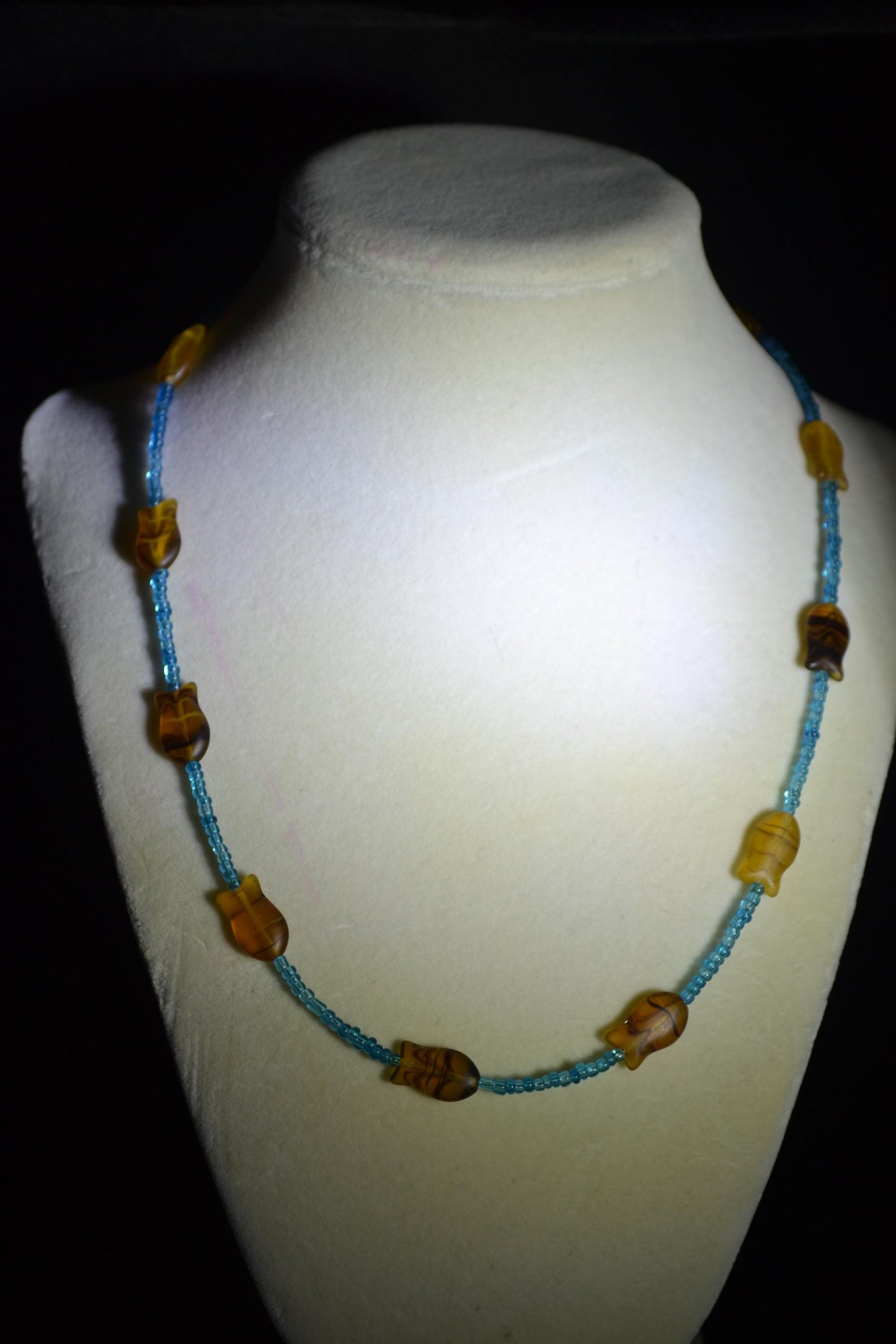Beaded fish necklace. Blue and topaz